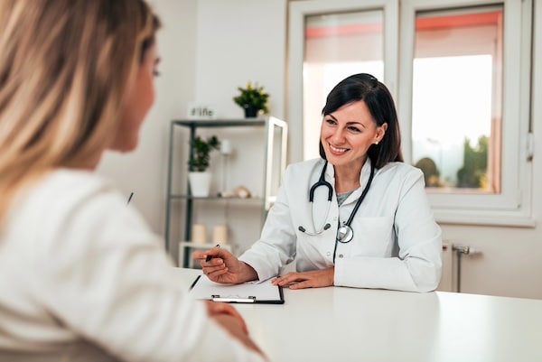 Consultation between a woman and her doctor